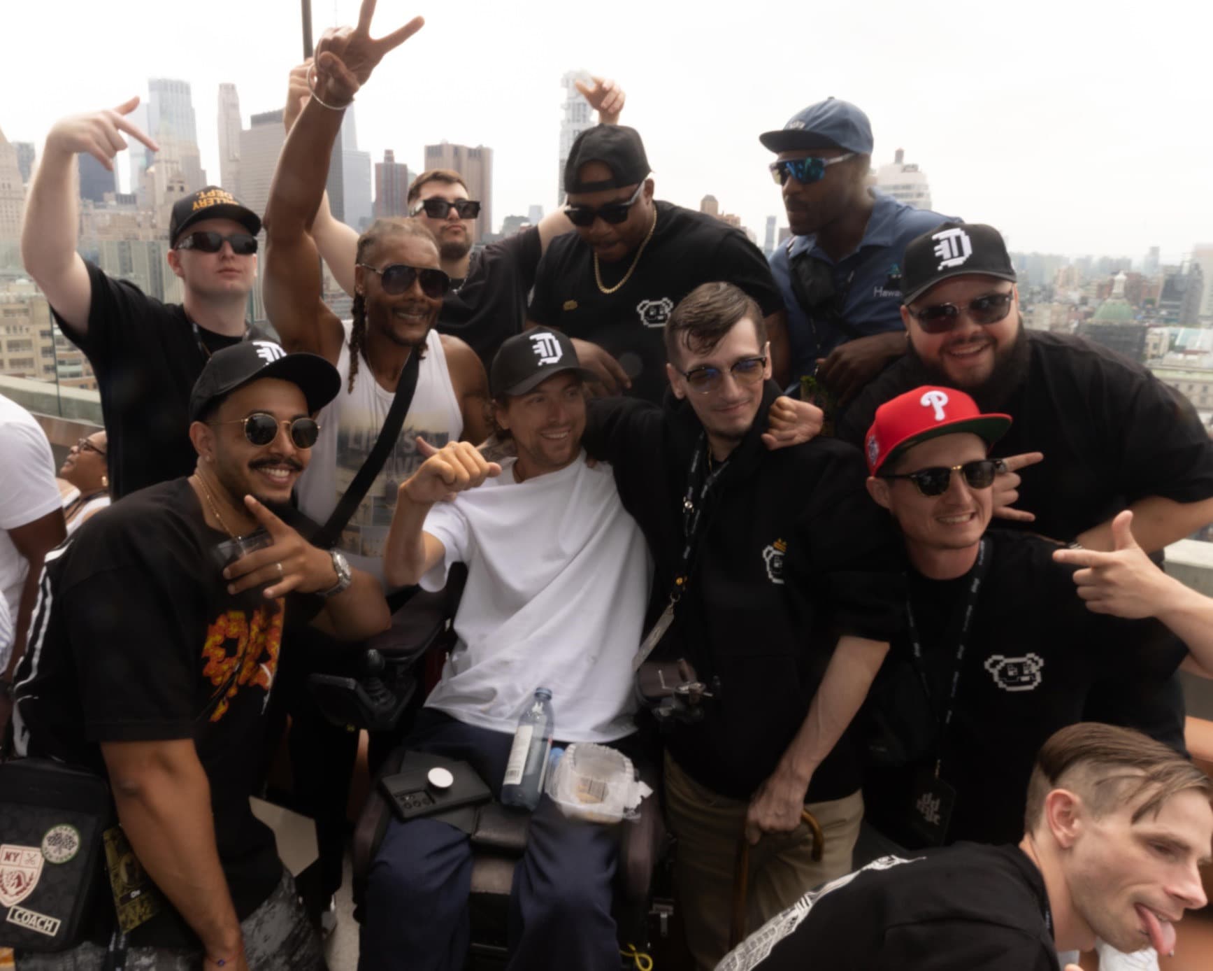 Crash (CrashMetaX) with the Doginal Dogs community on a New York rooftop Crash (CrashMetaX) surrounded by friends on a New York rooftop with the skyline behind them